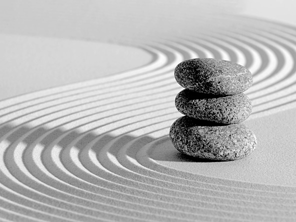 stack of rocks in sand garden